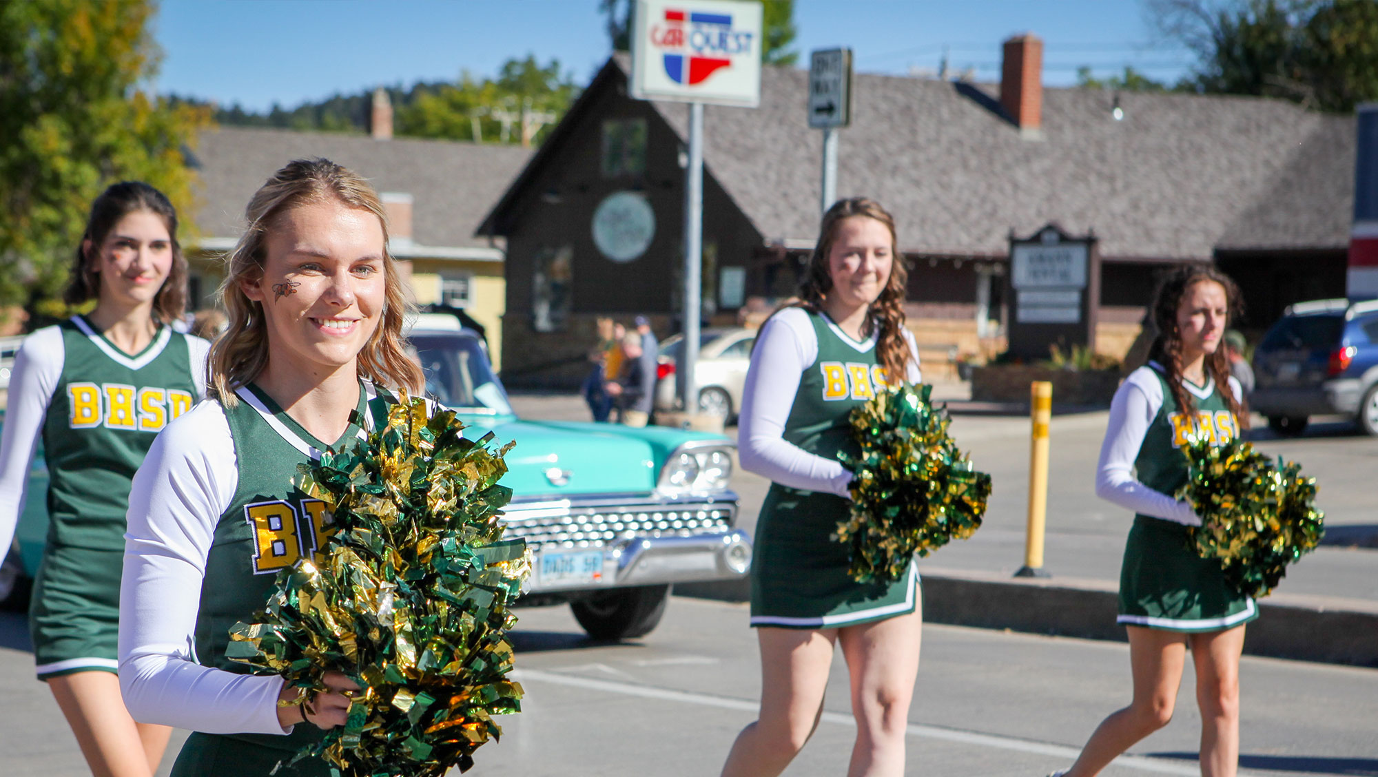 BHSU cheerleaders walk down Main Street in Spearfish during the parade at Swarm Days