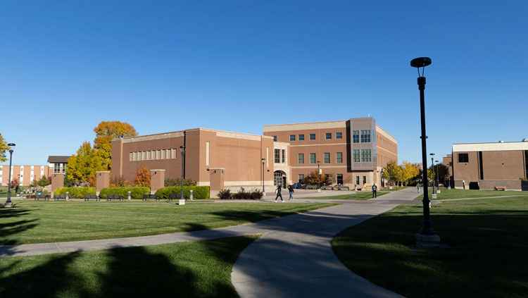 Students walking pasting Meier hall on a fall, October morning.