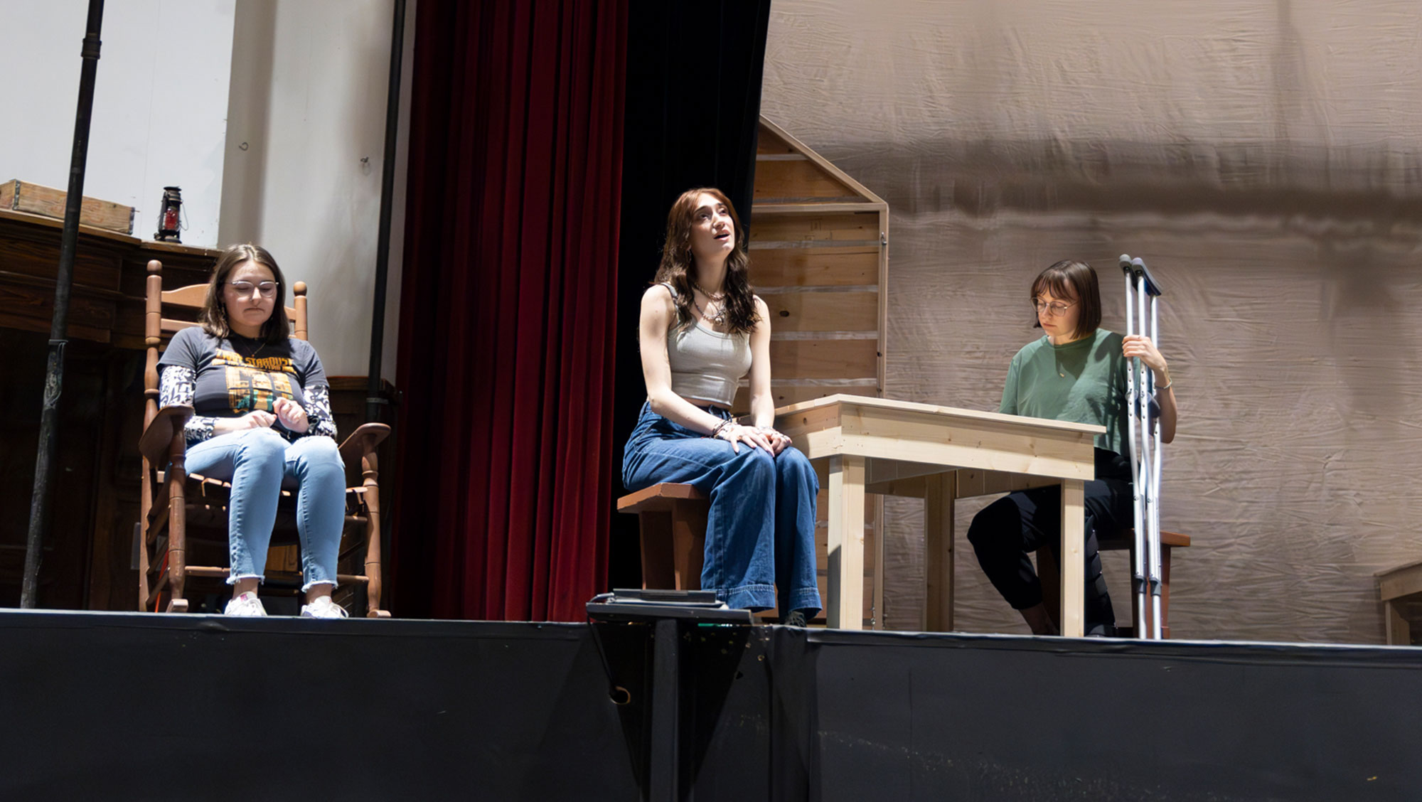 Gwen Hoops, Logan Culhane, and Rylann Olson rehearse a scene from “Little House on the Prairie: The Musical” in the Woodburn Auditorium on the BHSU Campus. 