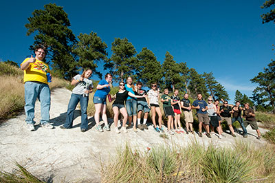 Sixteen Jacket Journal members pose for a photo.