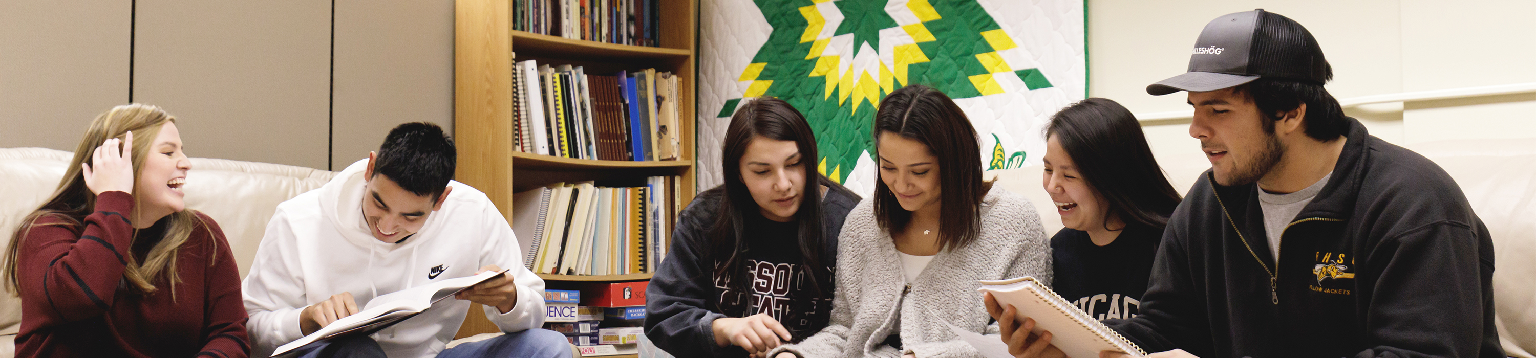 Six American Indian Studies students sit on a couch in the Center for American Indian Studies.