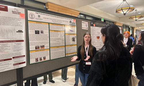 Girl presenting research at CUWip.