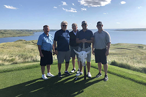 Picture of five golfers on the golf course