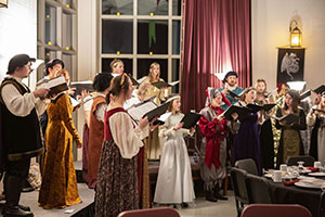 BHSU choir singing to the Madrigal Dinner attendees