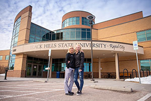 McKayla and Brittney Stratmeyer standing together in front of BHSU-Rapid City