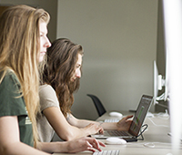 Two students working on computers