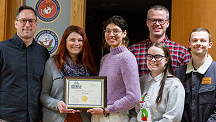 Students from the BHSU Arts Club receive the award for Community Service