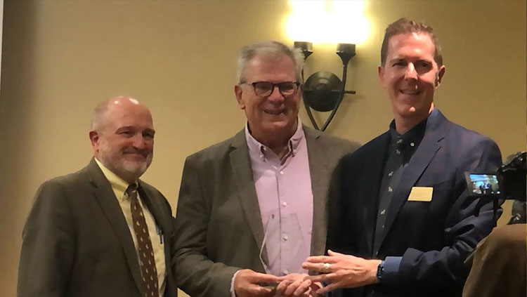 Dr. Thom Flamboe accepting 2021 Distinguished Alumni Award from the University of Wyoming's College of Health Sciences