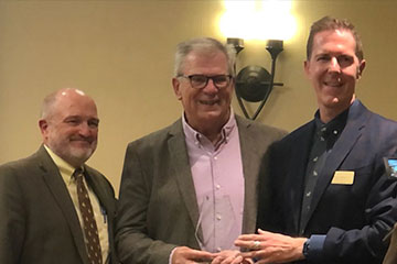 Dr. Thom Flamboe accepting 2021 Distinguished Alumni Award from the University of Wyoming's College of Health Sciences