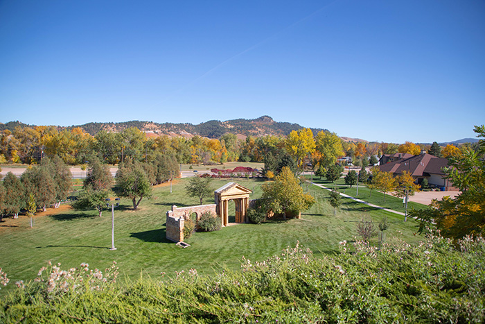 Photo of the campus green by the Joy Center in fall