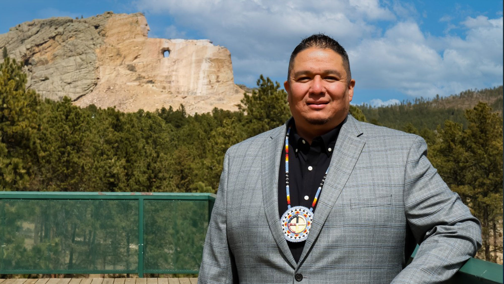 Whitney Rencountre Stands in front of Crazy Horse Memorial