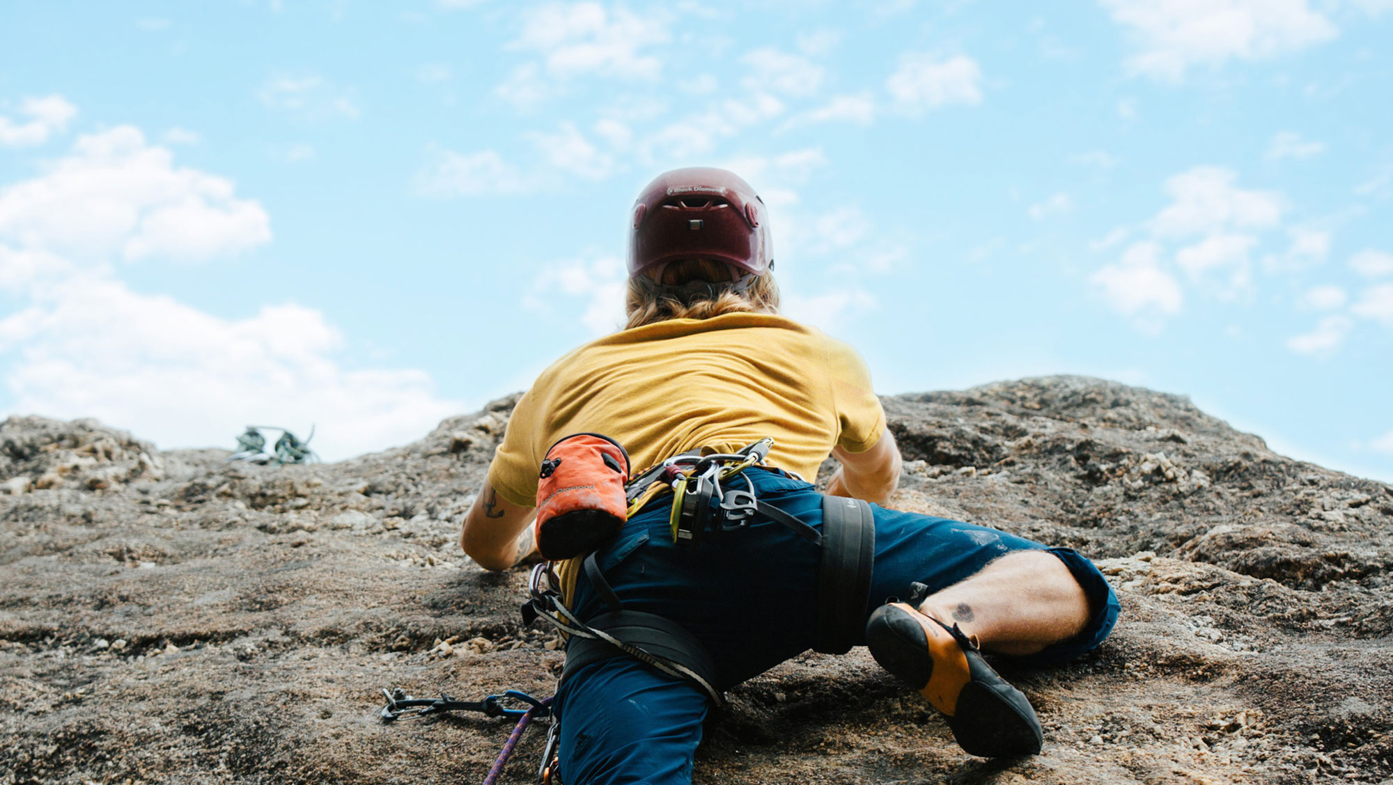 A BHSU student rock climbing in Spearfish Canyon