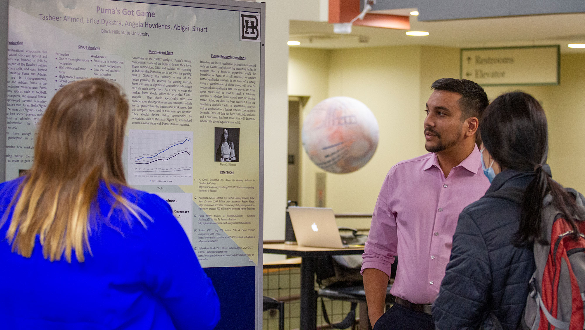 A BHSU student presents his research poster during the 2022 Black Hills Research Symposium