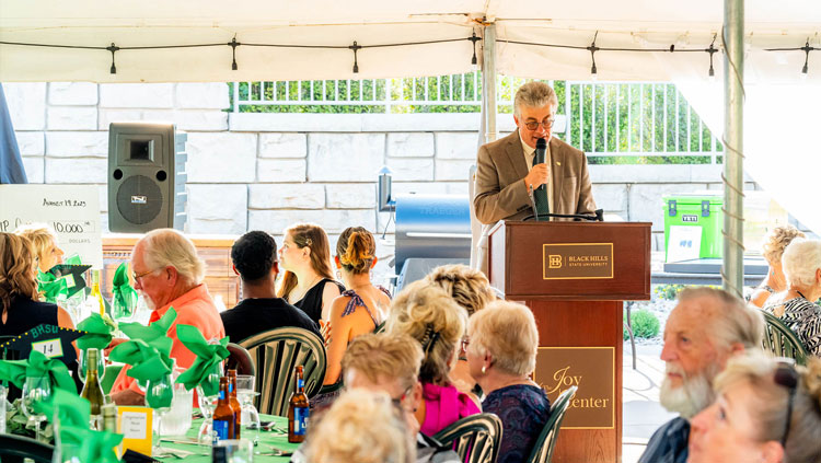 Vice President for University Advancement Steve Meeker addresses the attendees at the annual BHSU Scholarship Gala, sponsored by First Interstate Bank. 