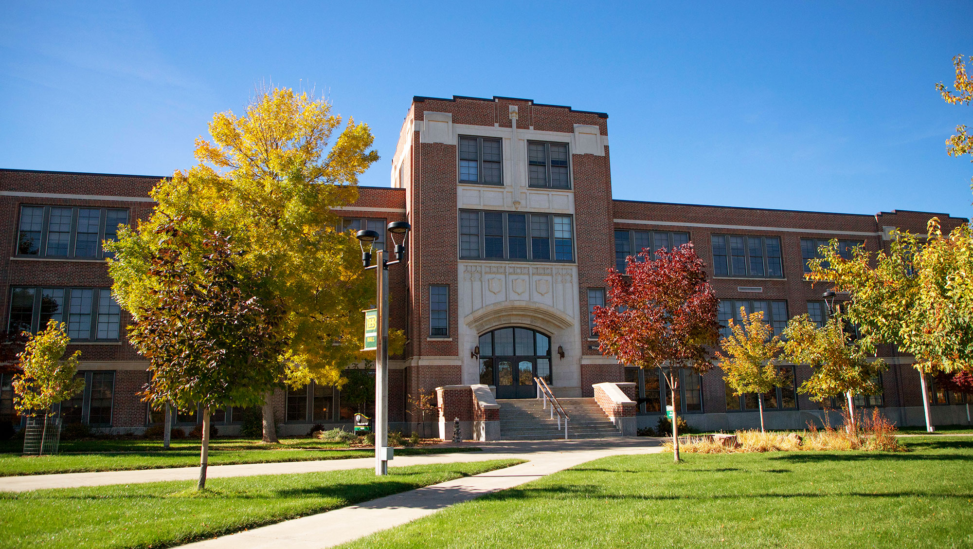 Image of Woodburn Hall on the BHSU campus--a brick building with fall foliage