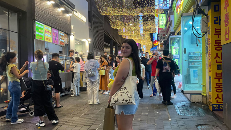 BHSU student Sheridan Fenner stands on a busy street in Seoul, South Korea.