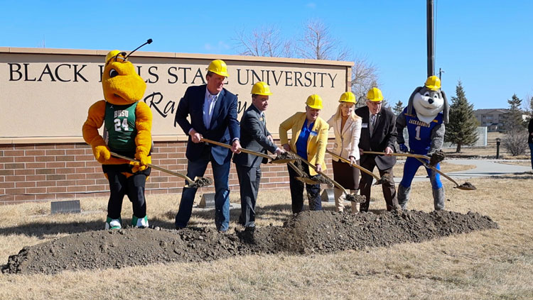 (From left) BHSU Mascot Sting, South Dakota Regent Jeff Partridge, BHSU President Steve Elliott, SDSU Dean of Nursing Mary Anne Krogh, Monument Health President and CEO Paulette Davidson, SDSU President Barry Dunn, and SDSU Mascot Jack.
