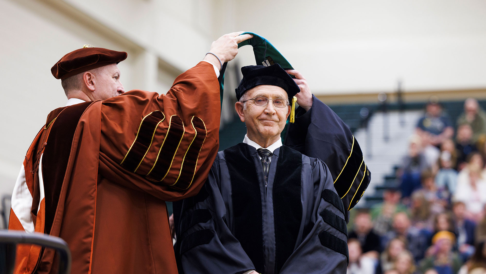 Jim D. Neiman receives his doctorate graduation hood after being presented with an honorary doctorate from Black Hills State University at the 187th Commencement Ceremony May 4.
