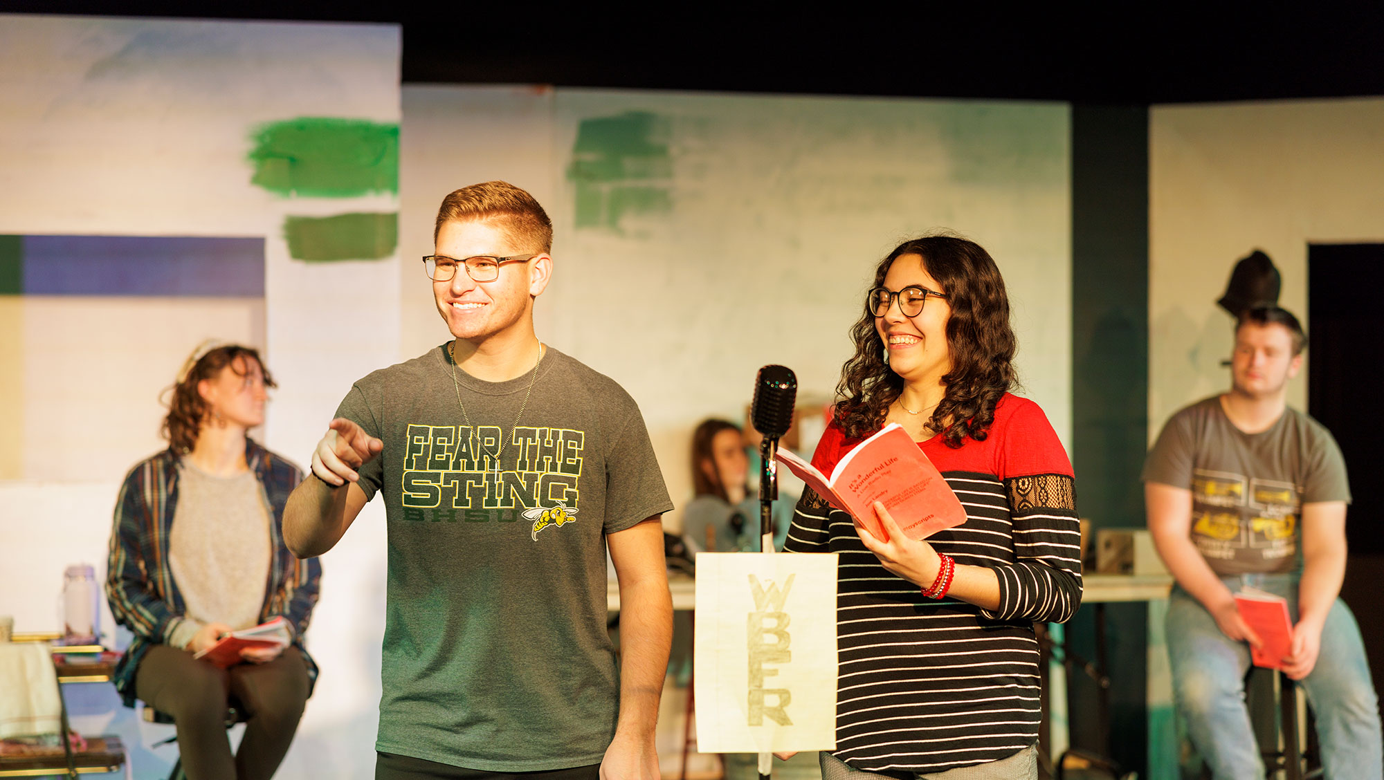 The cast of the BHSU theatre production of “It’s A Wonderful Life: A Live Radio Play” rehearses in the Woodburn Black Box Theatre.
