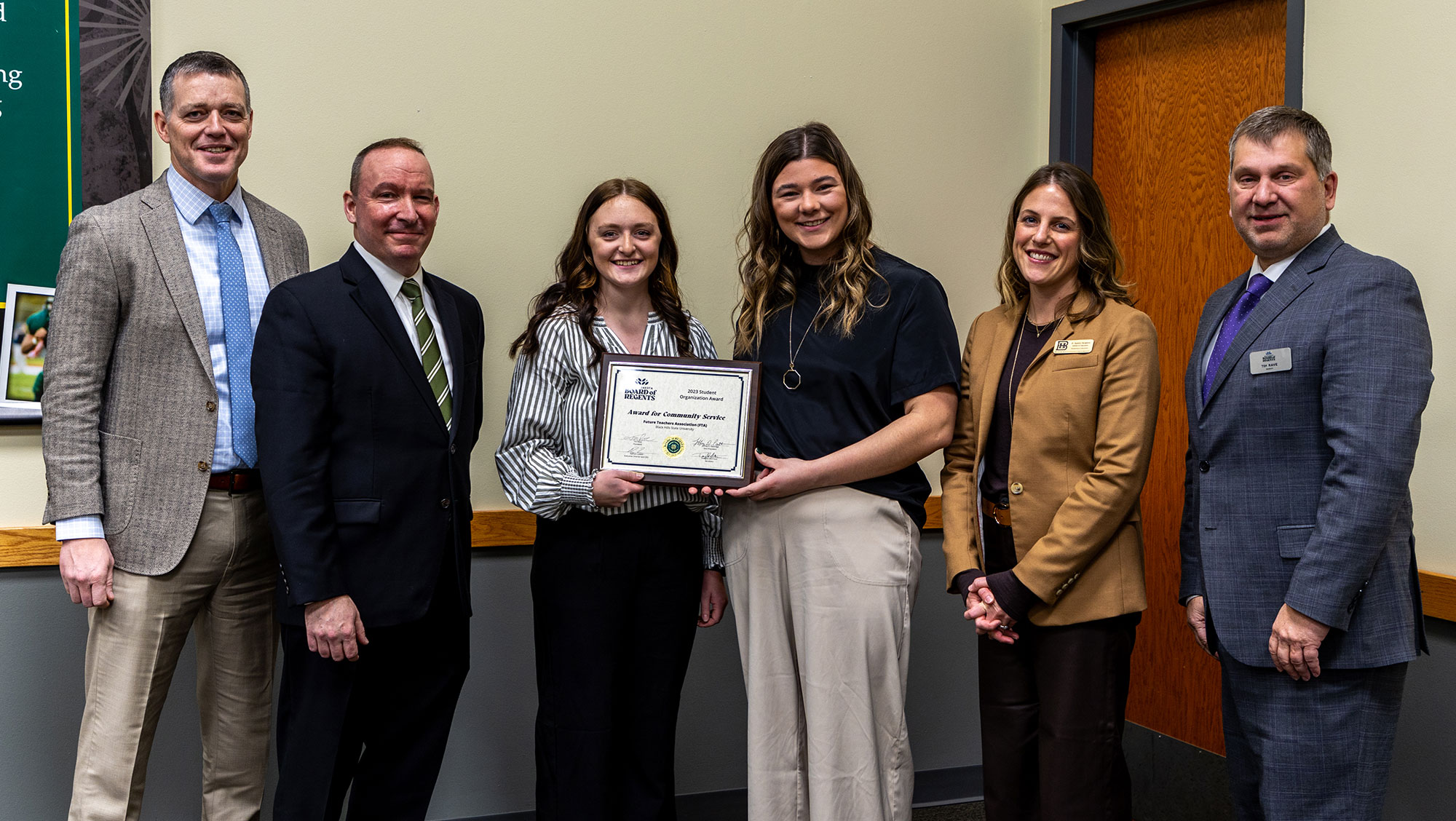 Image of BHSU Students from the Future Teachers Association receiving award from SDBOR