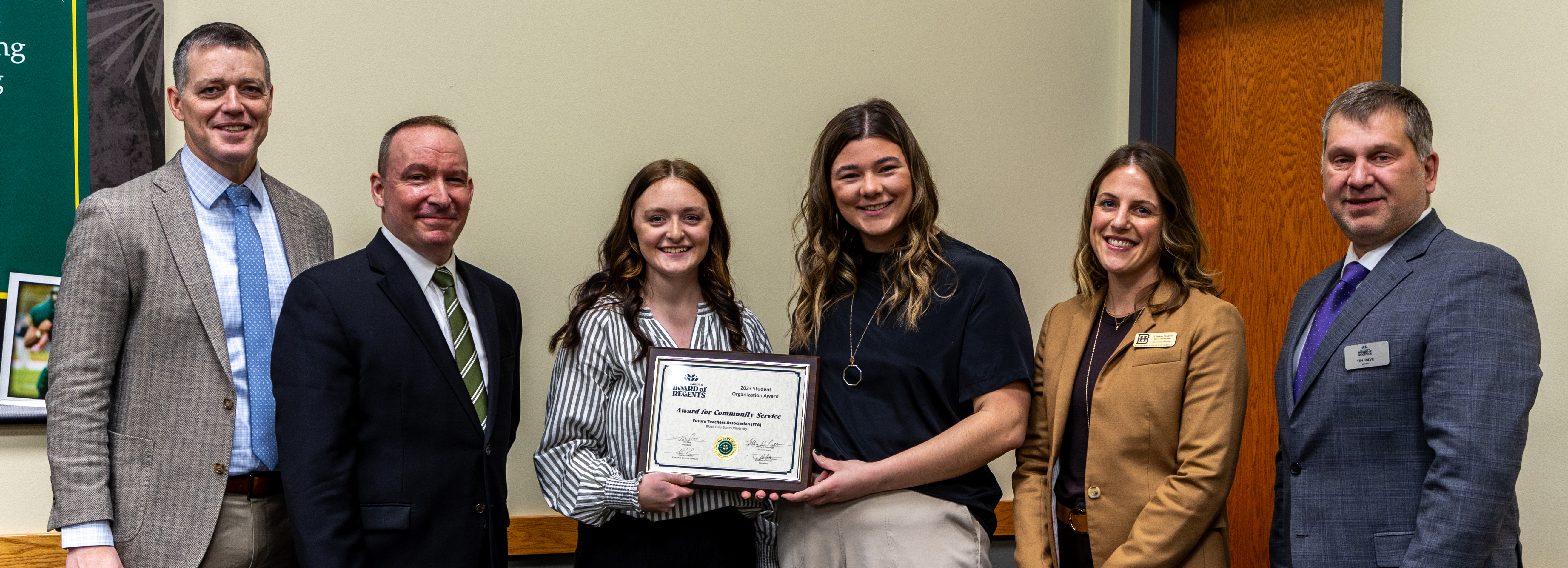 Image of FTA accepting award from SDBOR