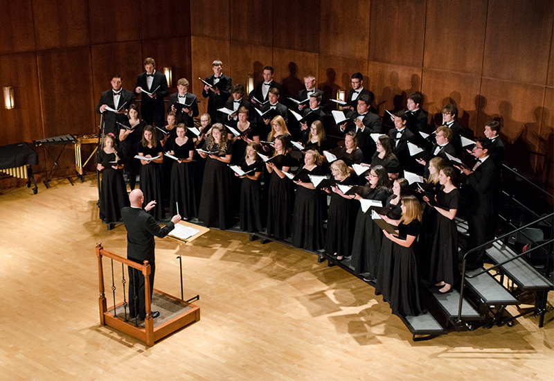 A choir sings in the Clare and Josef Meier recital hall.