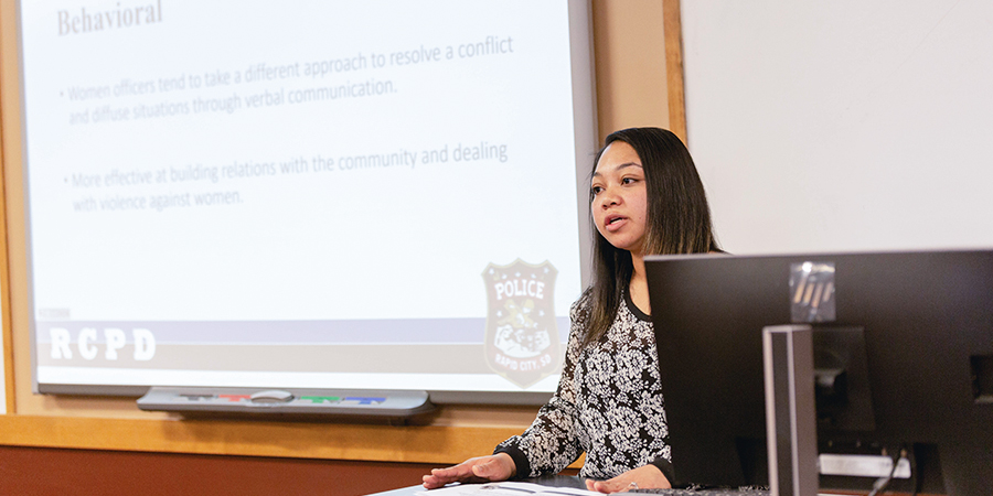 A women gives a presentation. 