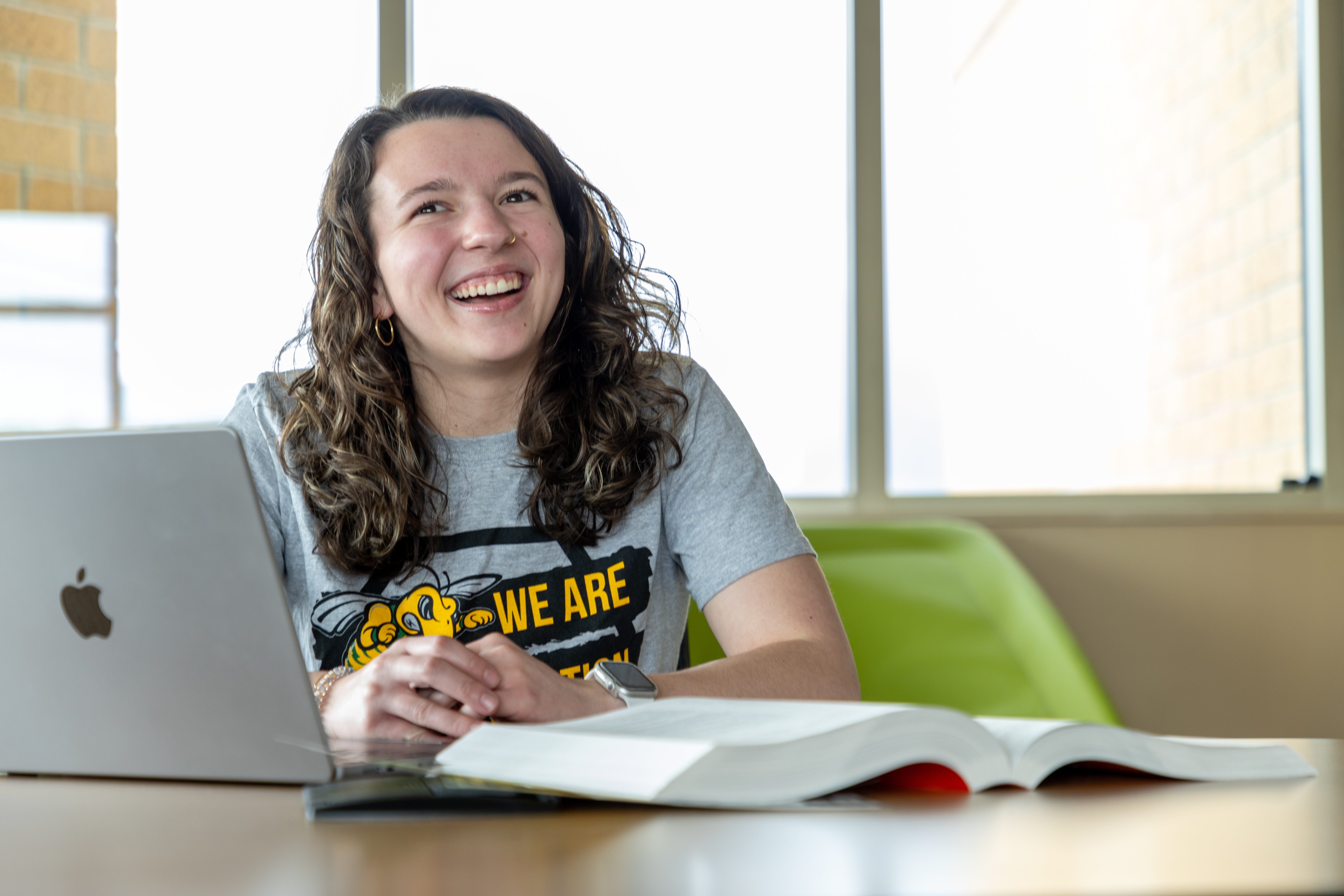 A graduate students completes her homework online.