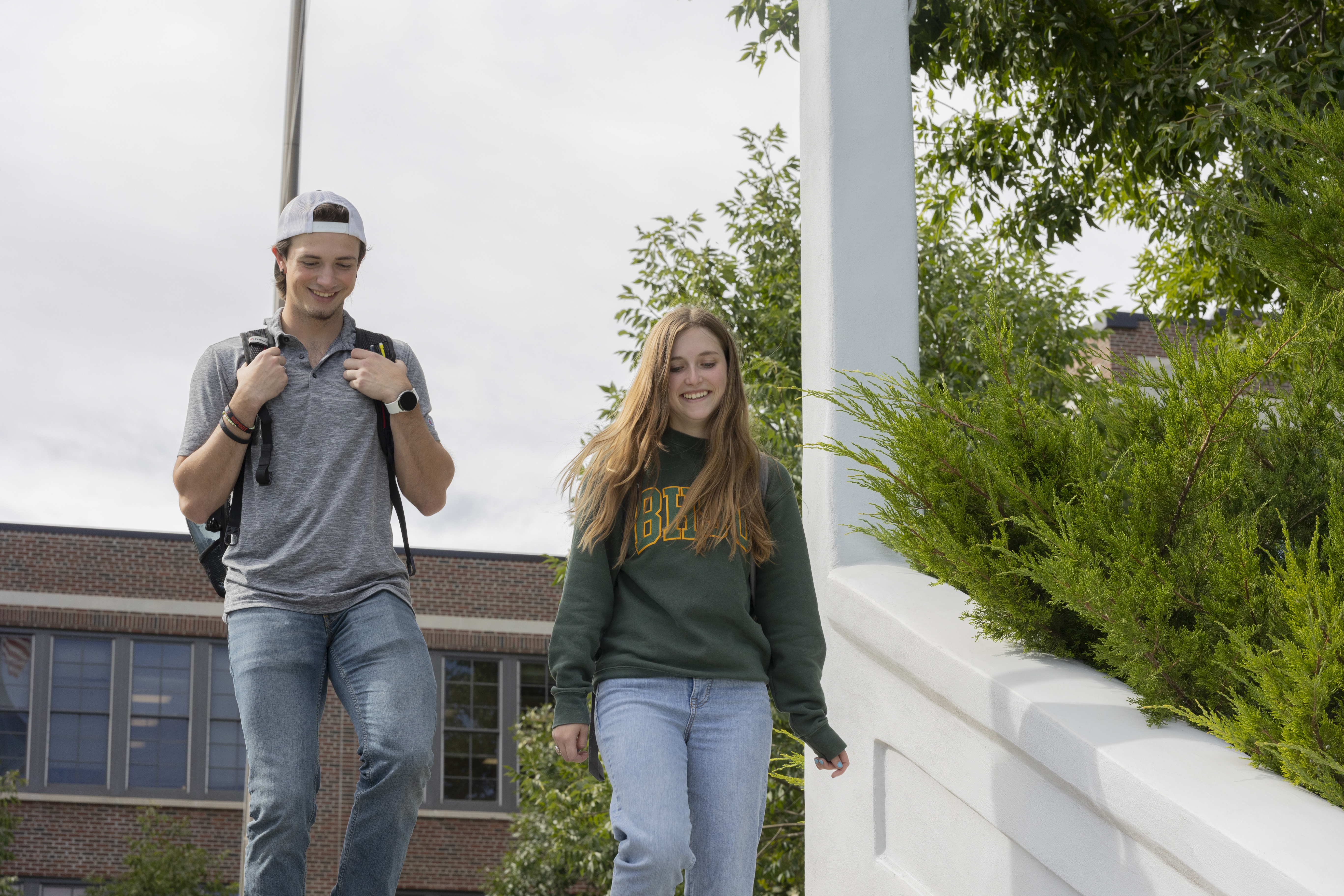 Two BHSU students walk on campus.