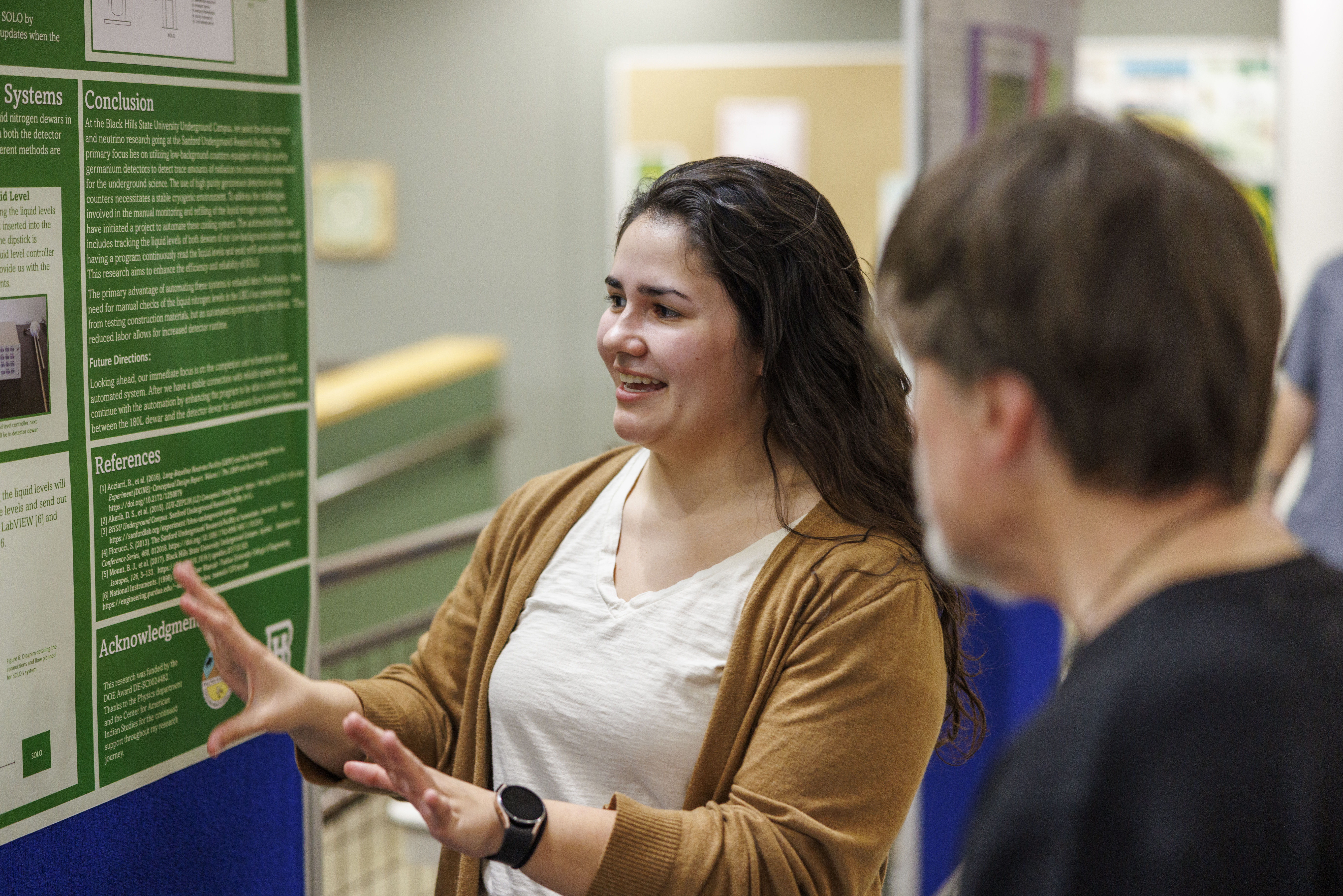A BHSU physics student presents her reasearch at the BHSU Research Symposium.