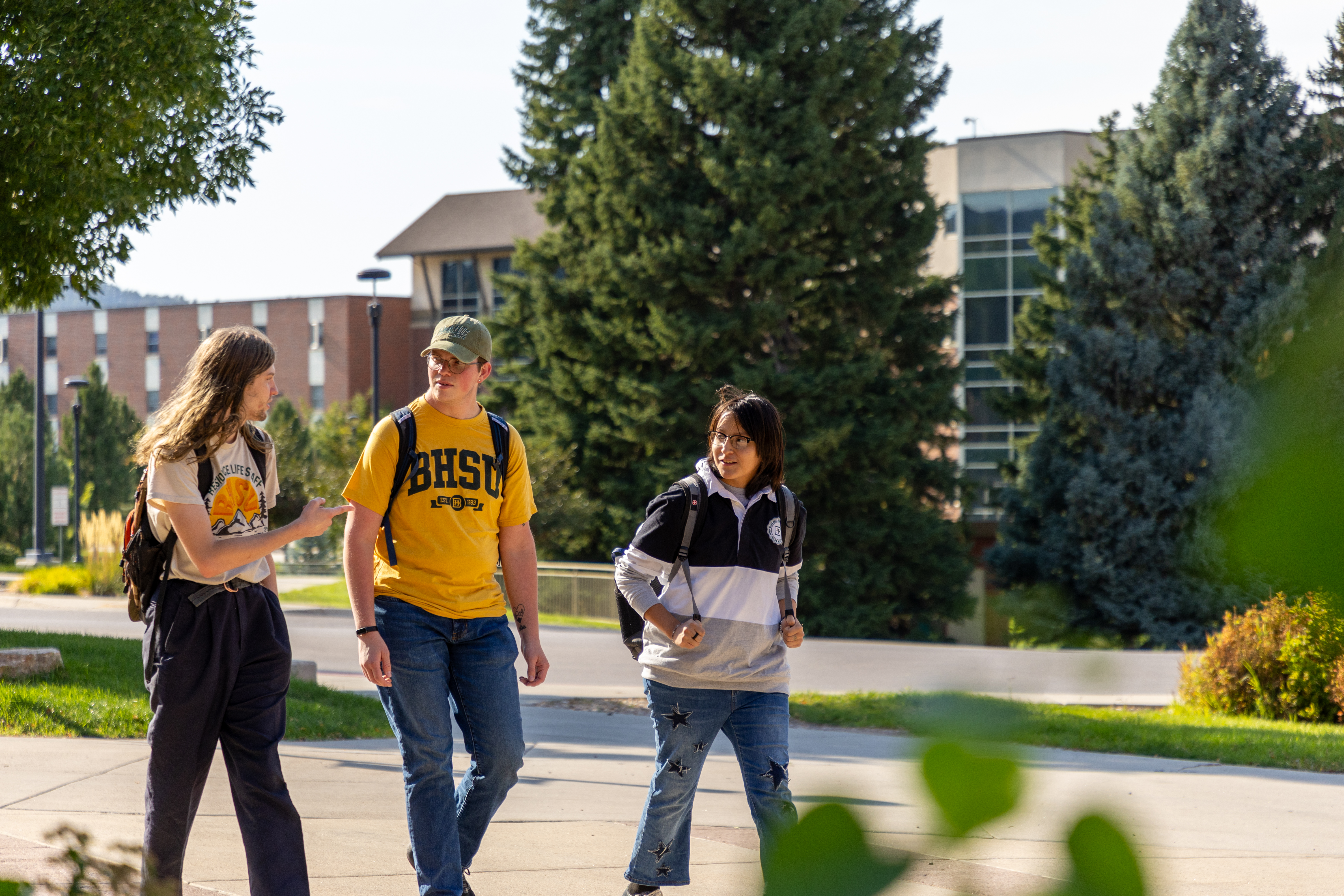 Three BHSU students walking on campus.
