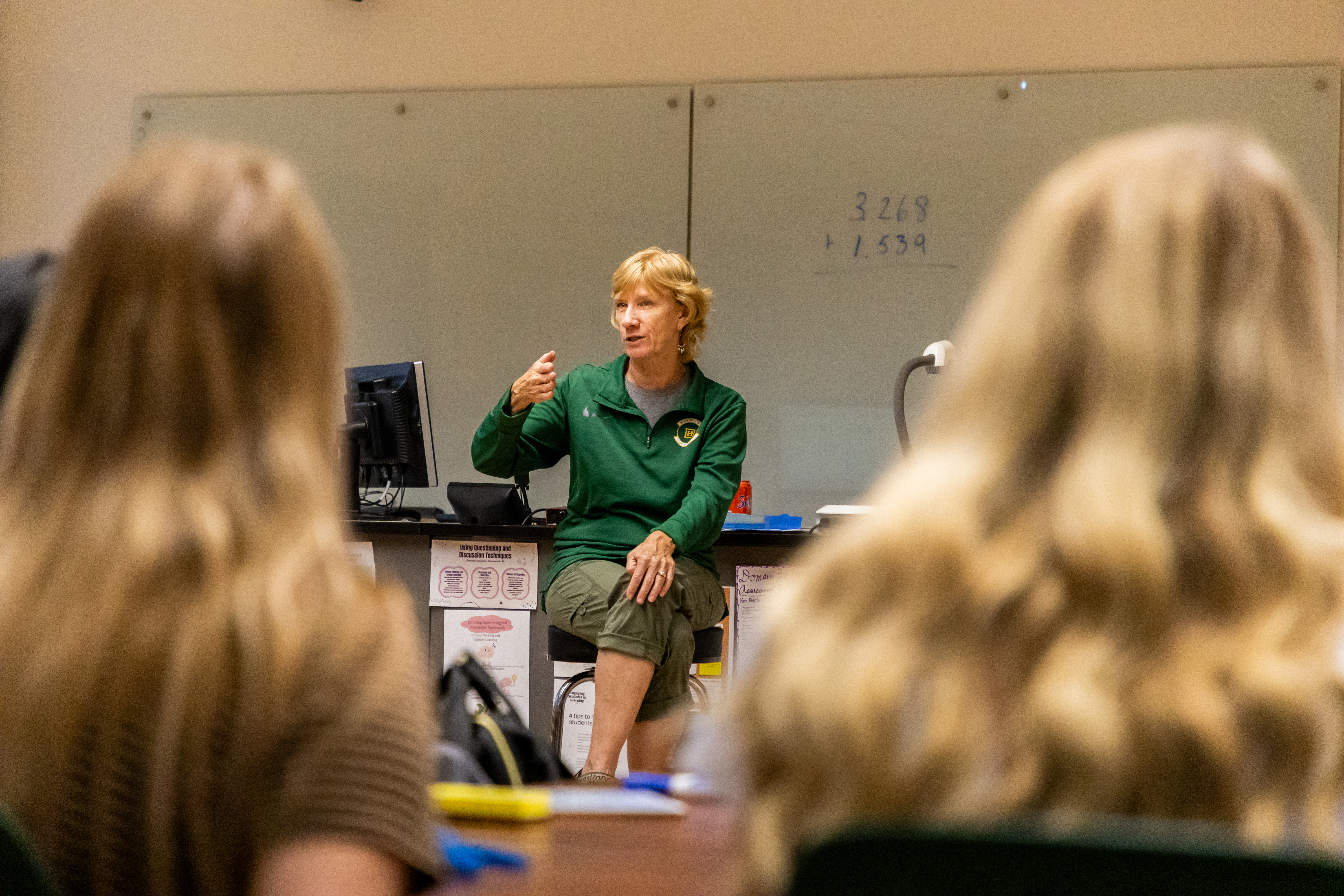 An education professor lectures a class.