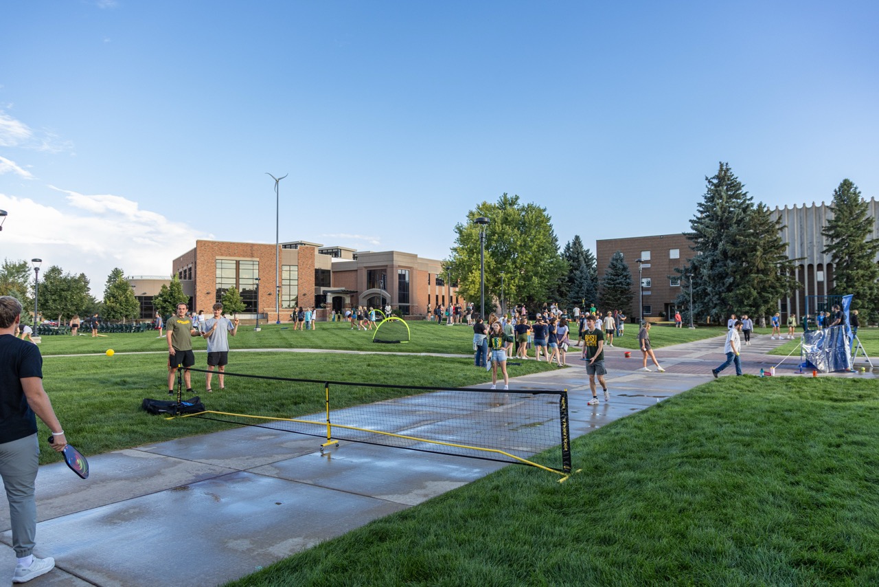 Campus Green filled with students having fun for Green & Gold Days