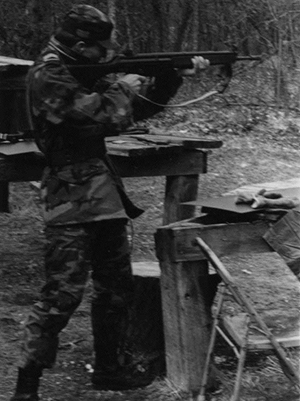 Cadet learning to shoot rifle during FTX.