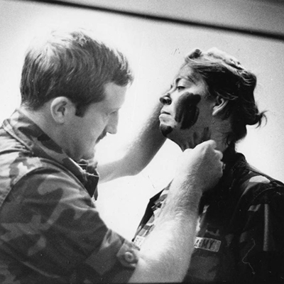 Cadet having face camouflage applied.