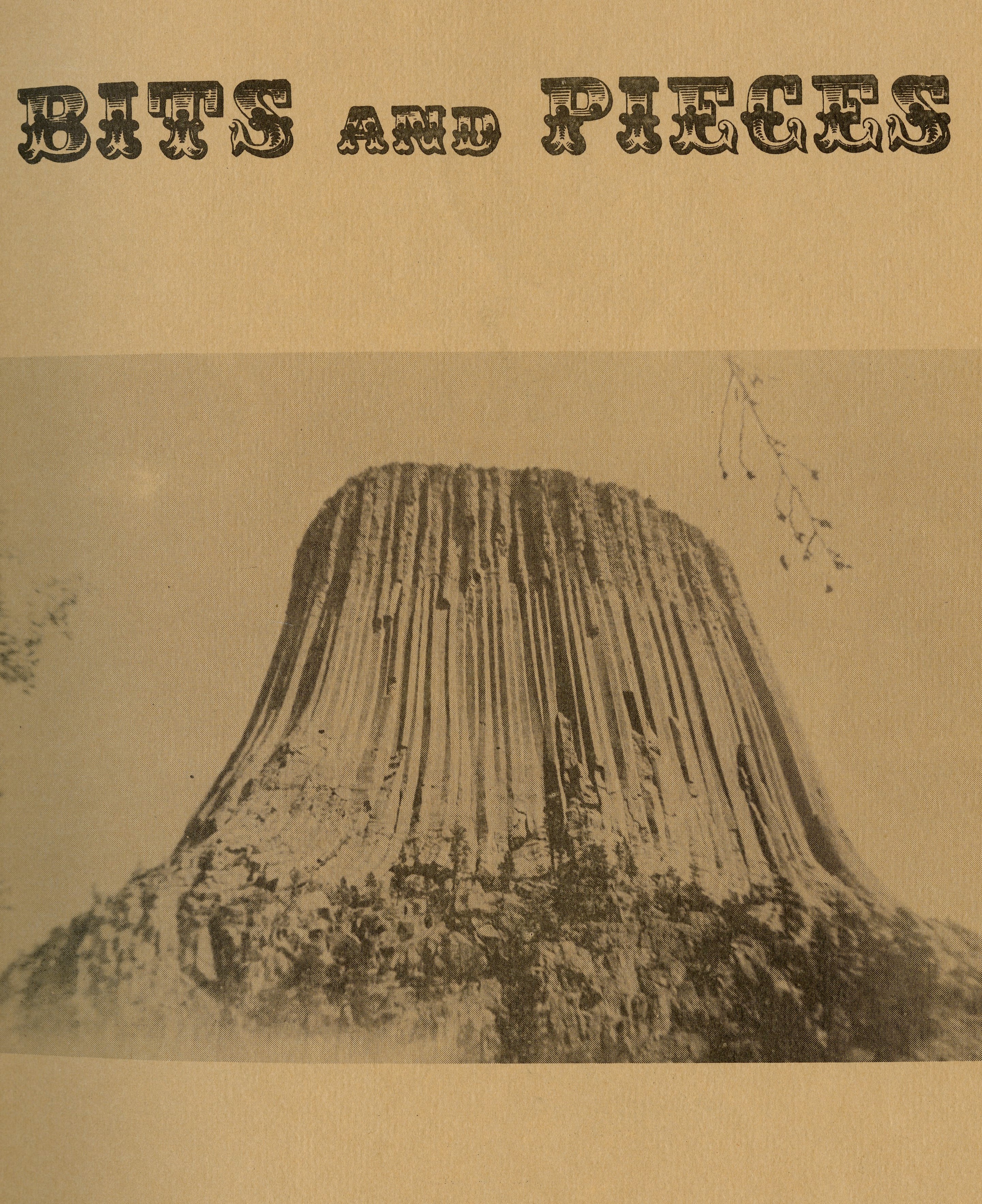 "Bits and Pieces" text above Devil's Tower