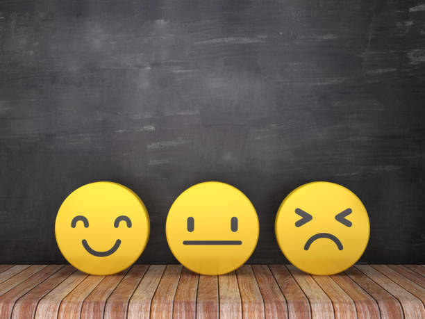 3 emojis on a wooden table