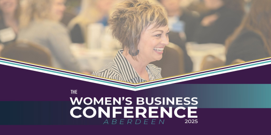 Headshot of a woman smiling with the tag "Women's Business Conference Aberdeen"