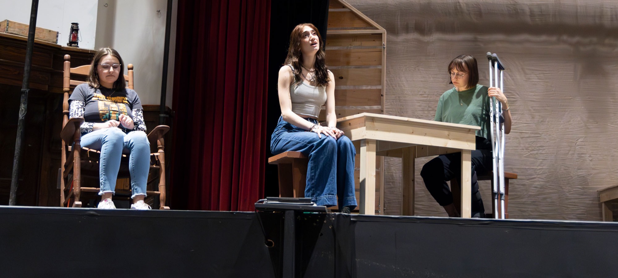 Gwen Hoops, Logan Culhane, and Rylann Olson rehearse a scene from “Little House on the Prairie: The Musical” in the Woodburn Auditorium on the BHSU Campus. 