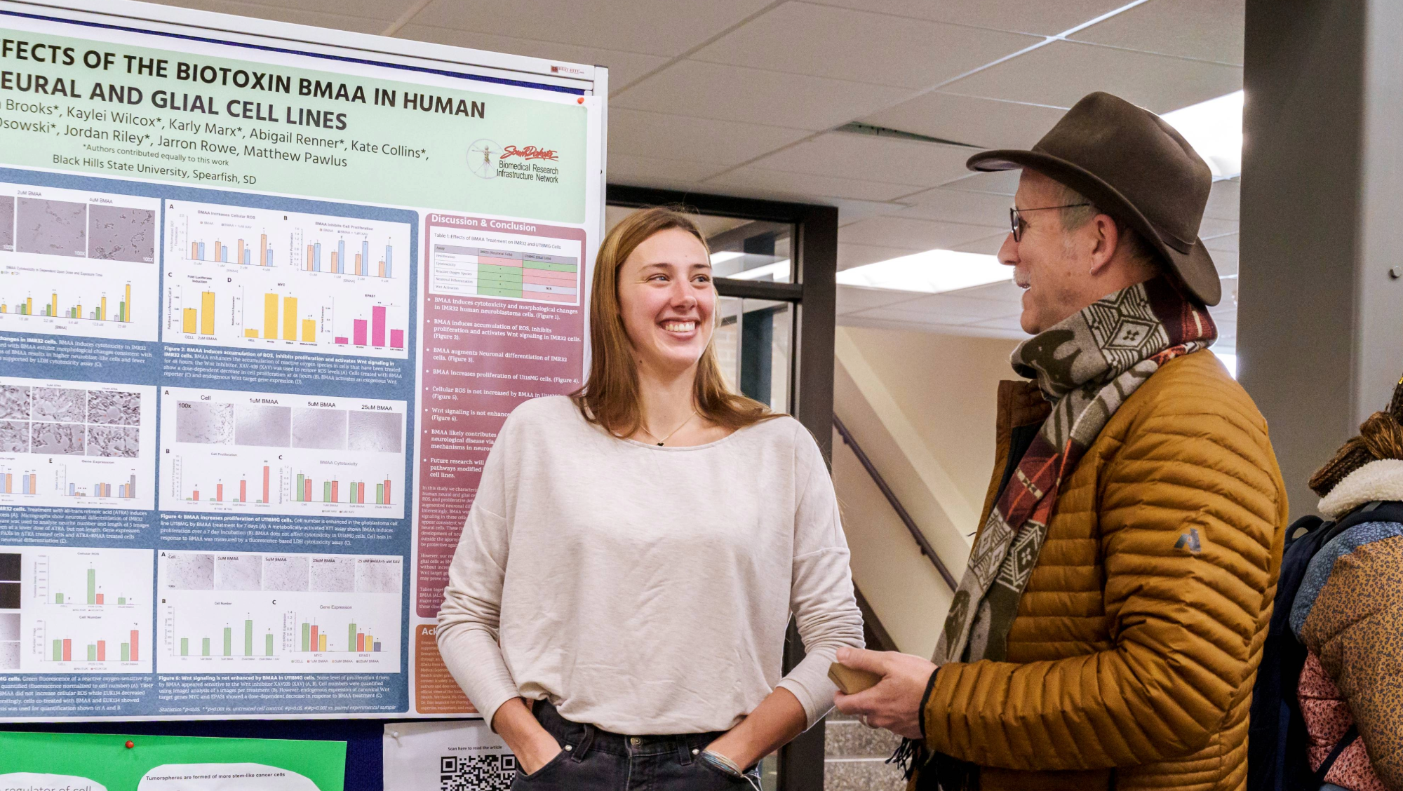 A BHSU student shows off her research at the 2024 Research Symposium