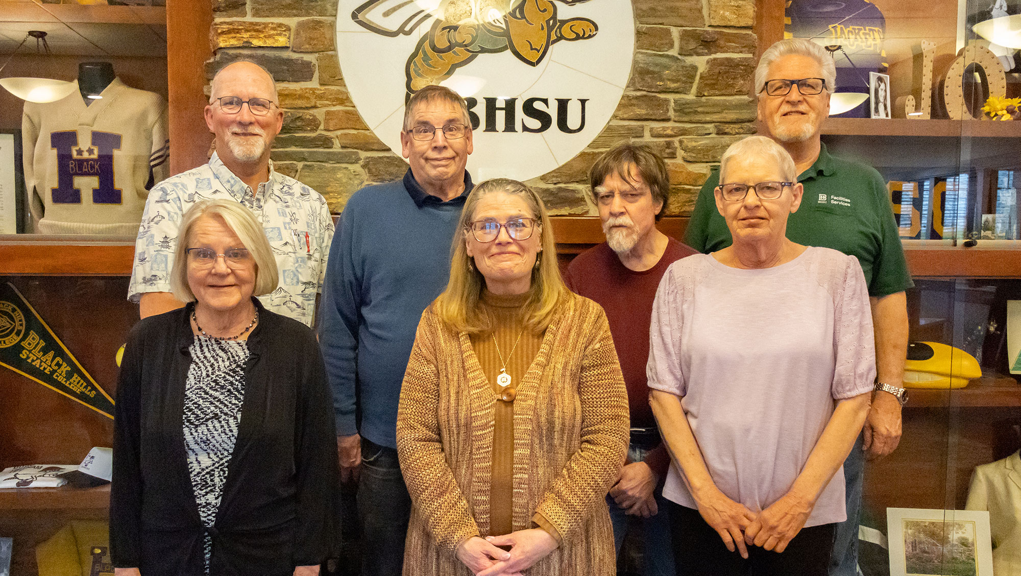 BHSU honored several retiring faculty and staff during the Retiree Reception April 30. (Back, from left: Charlie Lamb, Paul Kohler, Brian Smith, and Gary Callies. Front, from left: Roxy Schmit, Laura Colmenero-Chilberg, and Fae Marshall.) 