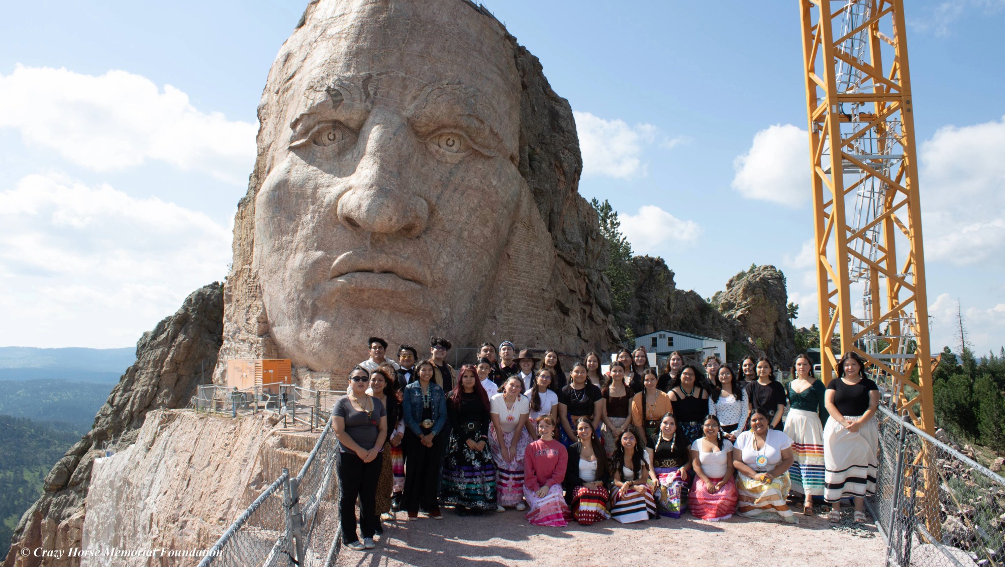 The 7TH GEN. First Year cohort graduates stand in front of Crazy Horse Memorial.