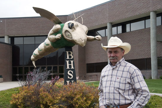 Tony Chytka with the Sting sculpture outside of the Young Center.