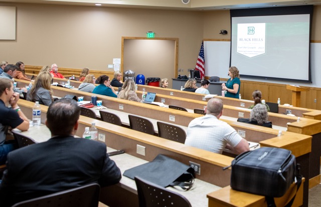 Fuel the Growth attendees listening to lecture in classroom