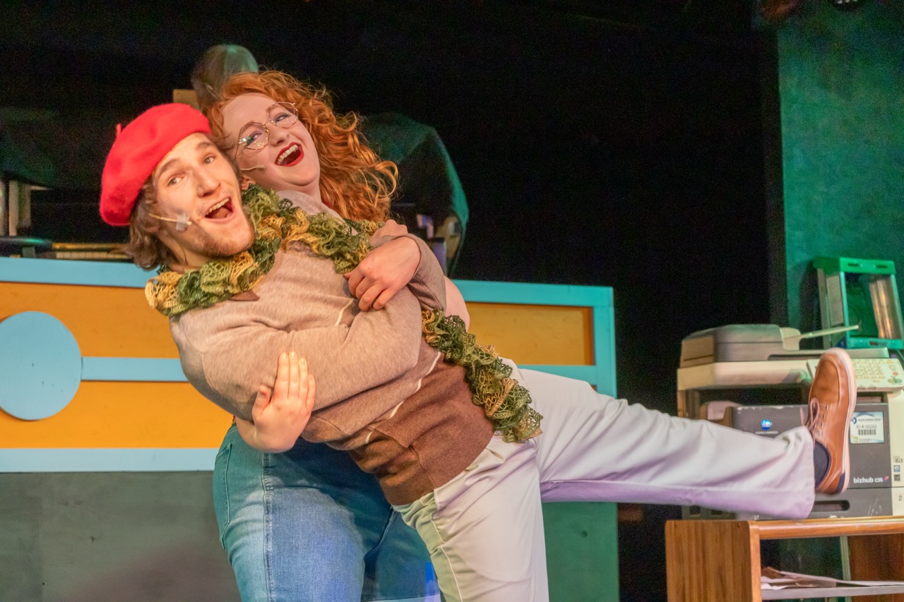 Two BHSU Student theatre majors leaning and singing as part of a dance routine.