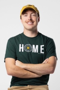 Graduate Noah Westergaard smiles for the camera 